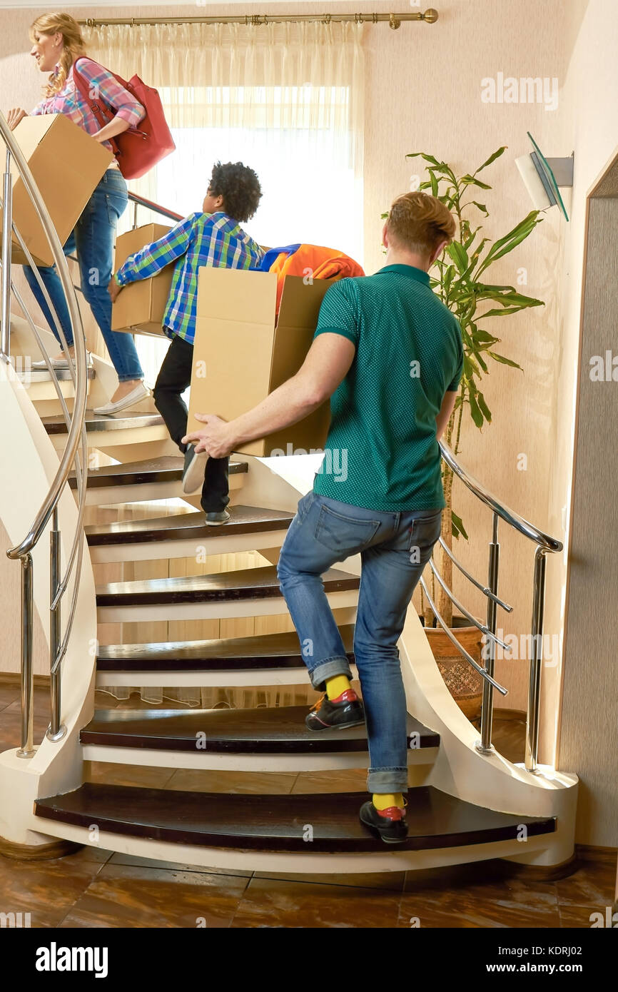 People carrying boxes upstairs Stock Photo Alamy