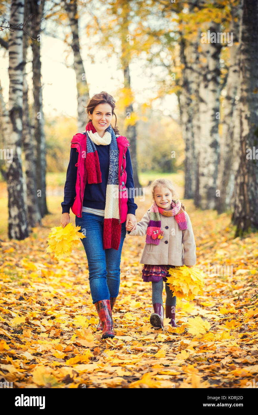 Mother and daughter in the autumn park Stock Photo - Alamy
