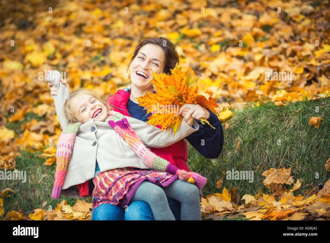 Mother and daughter in the autumn park Stock Photo - Alamy