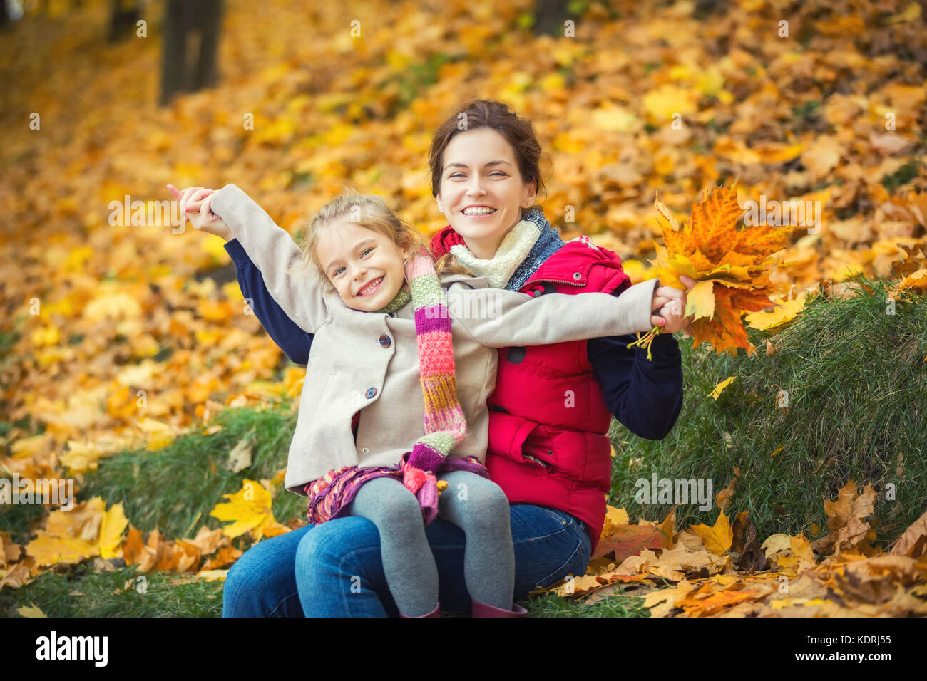 Mother and daughter in the autumn park Stock Photo - Alamy