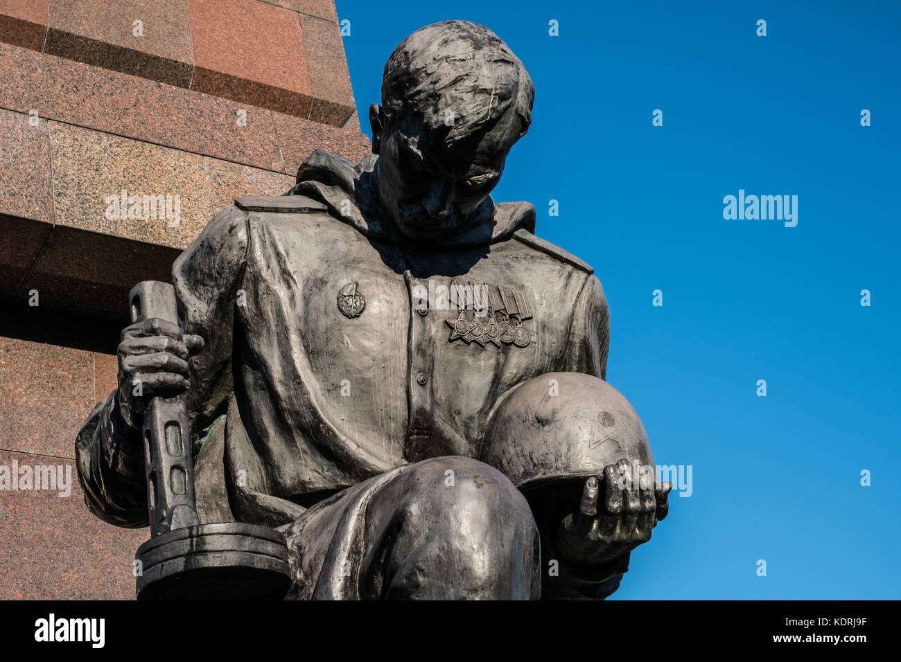 Berlin, Germany - october 2017: Statue of a russian soldier at the  Soviet War Memorial and military cemetery in Berlin's Treptower Park Stock Photo