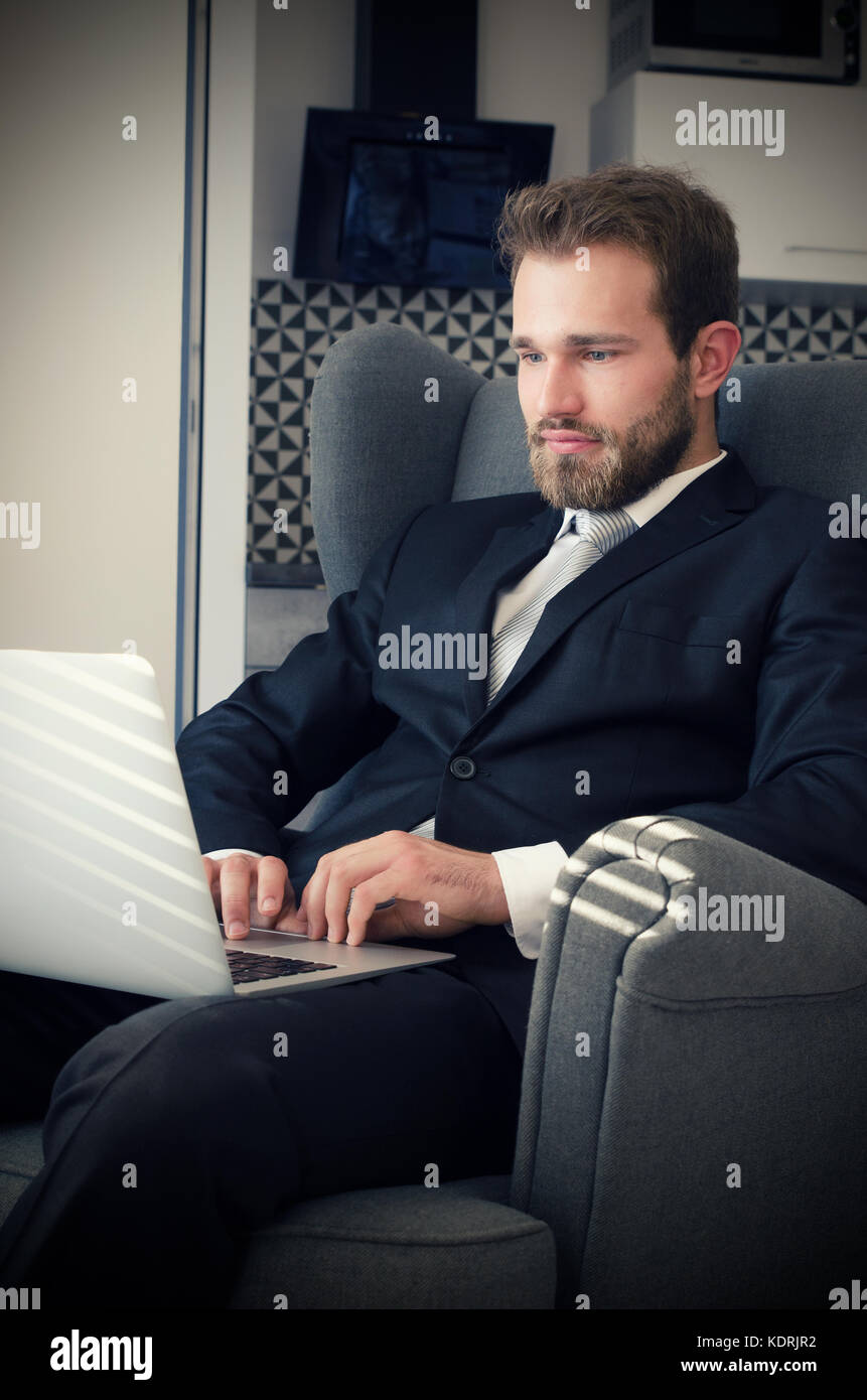 Young business man working from home with laptop. home computer businessman laptop concept Stock Photo