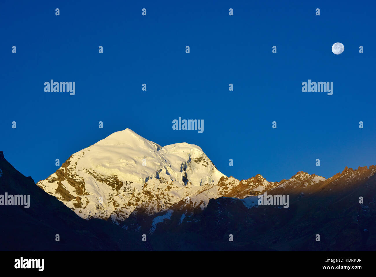 Dawn in the mountains: the first rays of the bright sun illuminated the ...