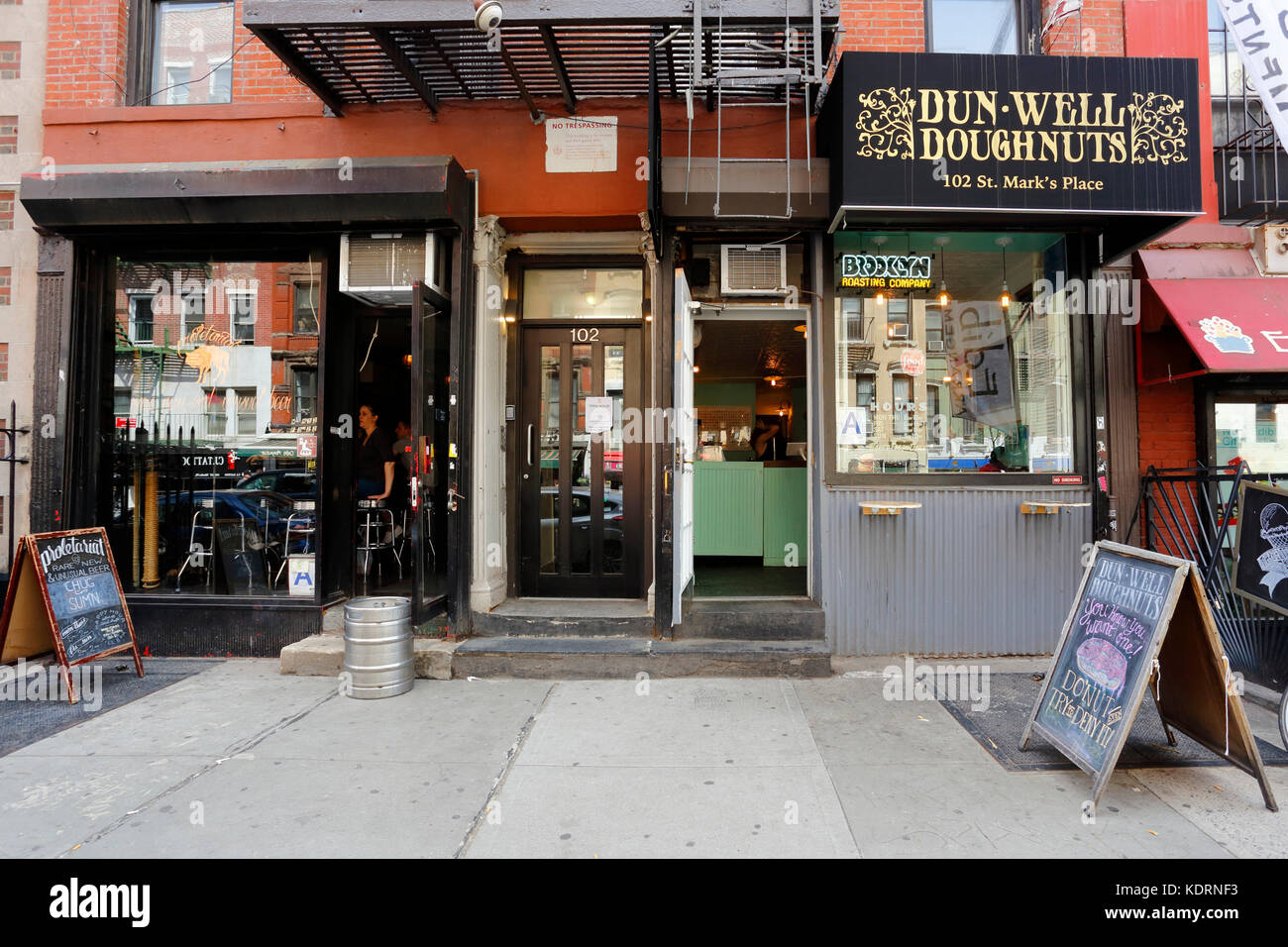 [historical storefront] Dun-Well Doughnuts, 102 St Marks Place, New York, NY. exterior storefront of a donut shop in the East Village. Stock Photo
