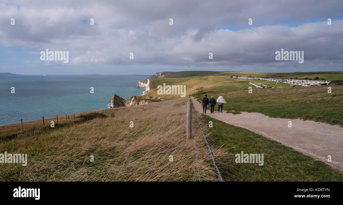 A wide view of the Jurassic Coast looking West towards Durdle Door from the South West Coast Path peak near Lulworth in Dorset, England, UK Stock Photo
