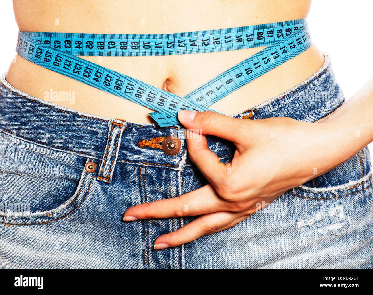 girls stomach measuring with tape twice isolated close up Stock Photo