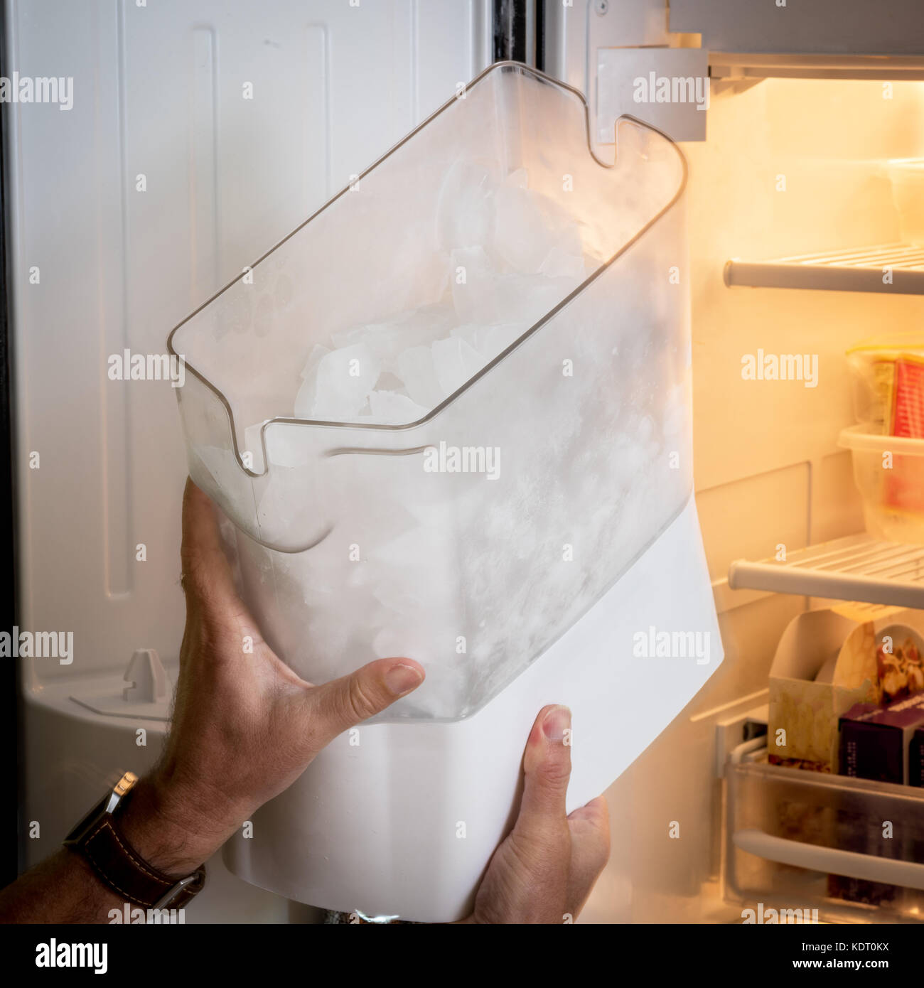 Bucket that holds ice from a freezer appliance Stock Photo