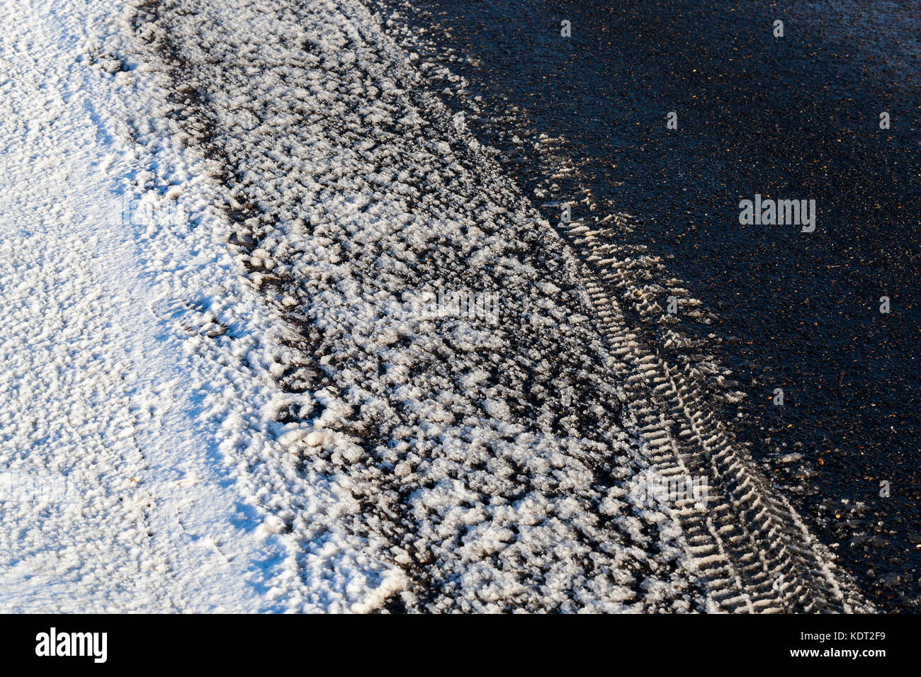 Asphalt road under the snow Stock Photo Alamy