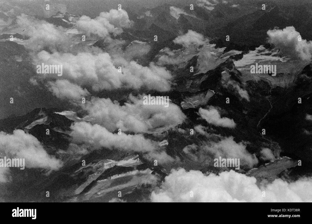 THE ALPES MOUNTAINS SEEN FROM THE SKY - MOUNTAINS - FLIGHT LANDSCAPE - BLACK AND WHITE PHOTOGRAPHY - SILVER IMAGE © Frédéric BEAUMONT Stock Photo