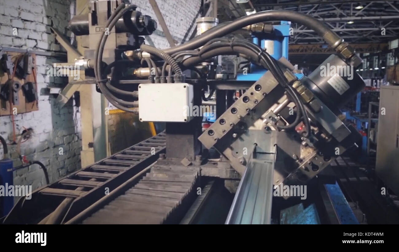 Manual worker cutting aluminium profiles. Manufacturing jobs