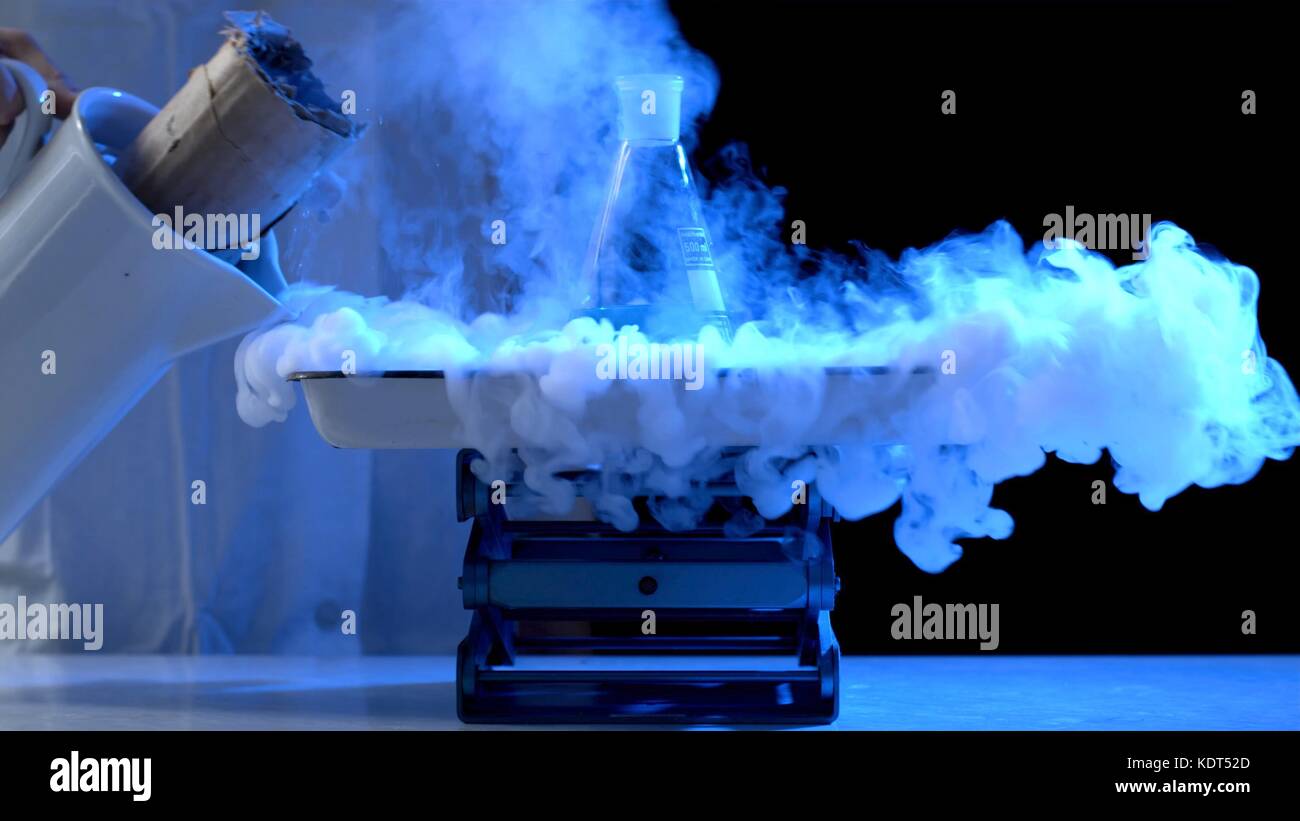 Bottle and liquid nitrogen in a laboratory. Chemical experiment. Flask