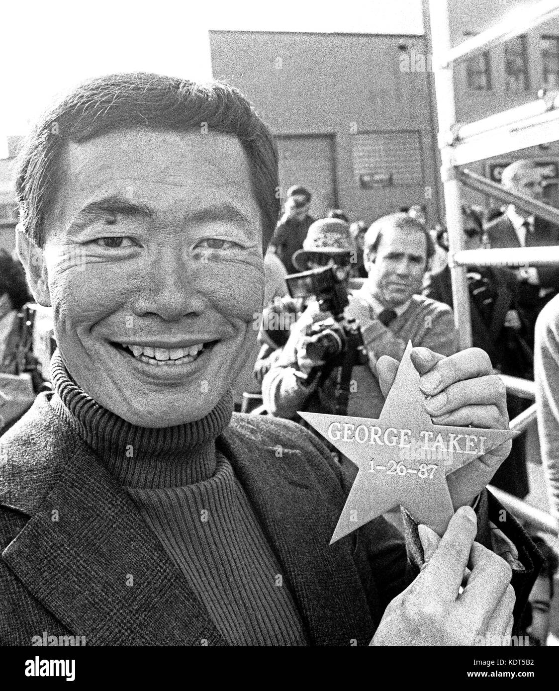 George Takei with his star he places in a San Francisco sidewalk. 1/26/1987 Stock Photo
