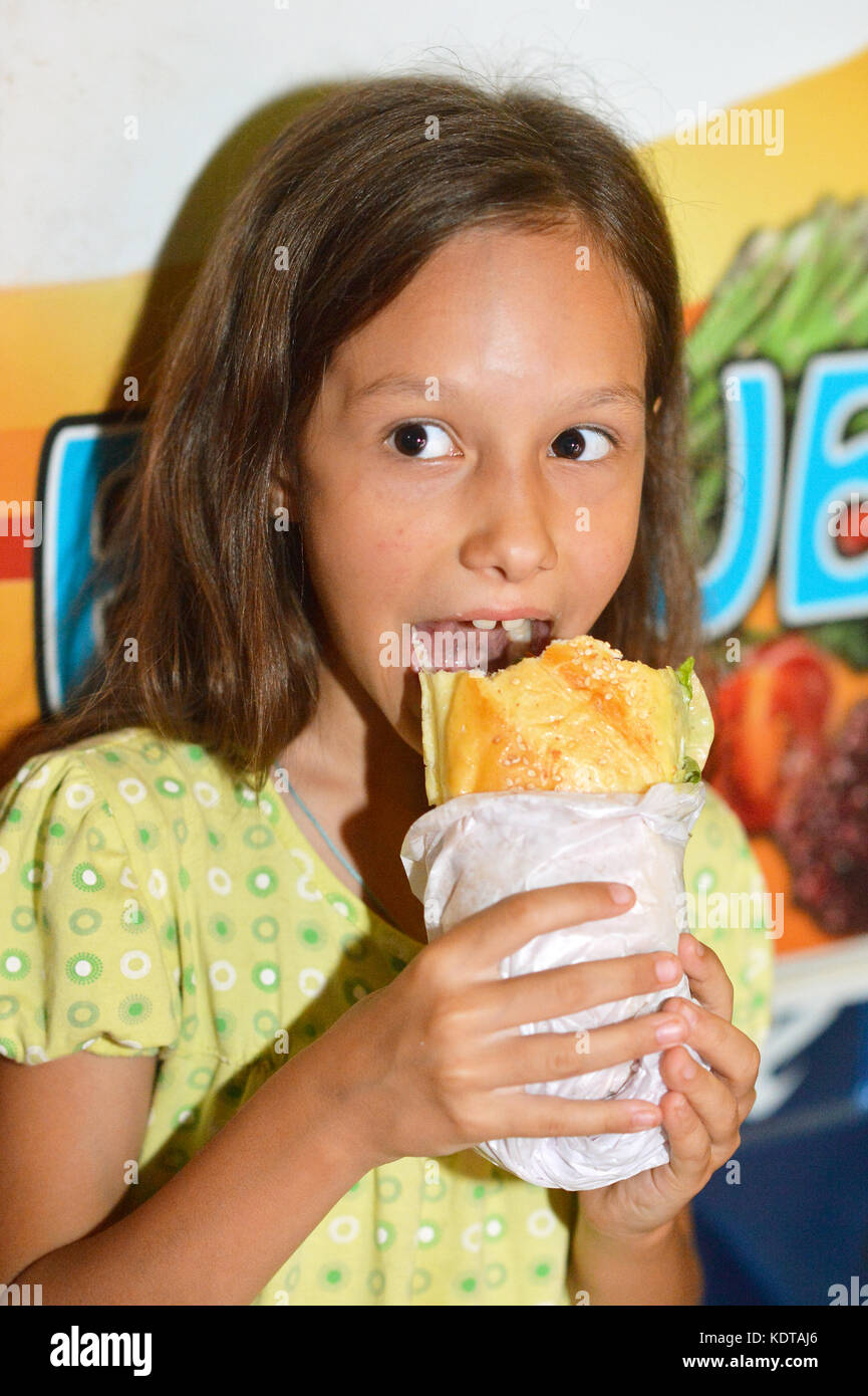 girl eating hot dog Stock Photo Alamy
