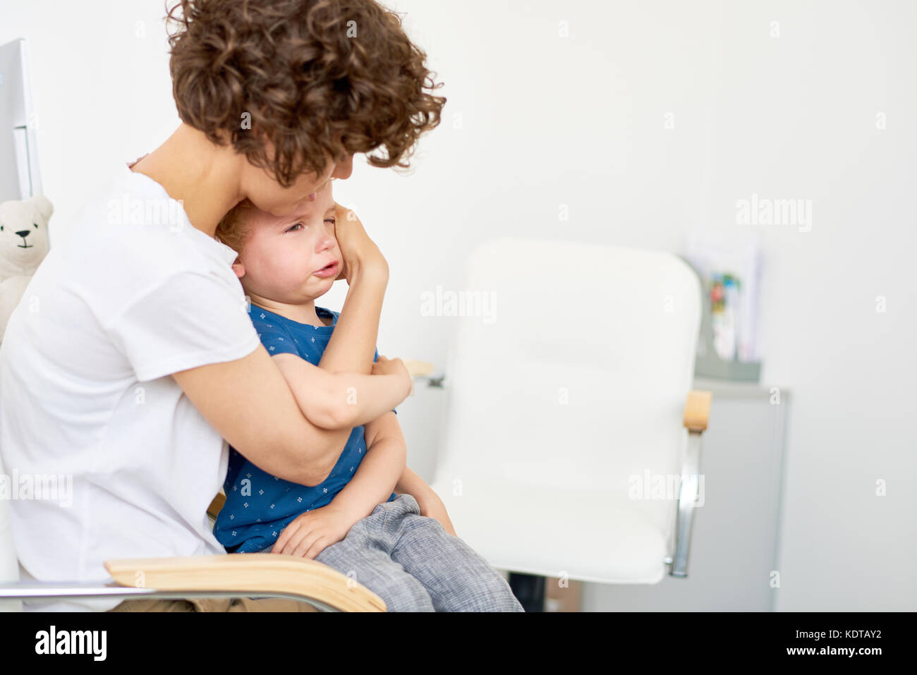 Little Child Crying in Doctors Office Stock Photo