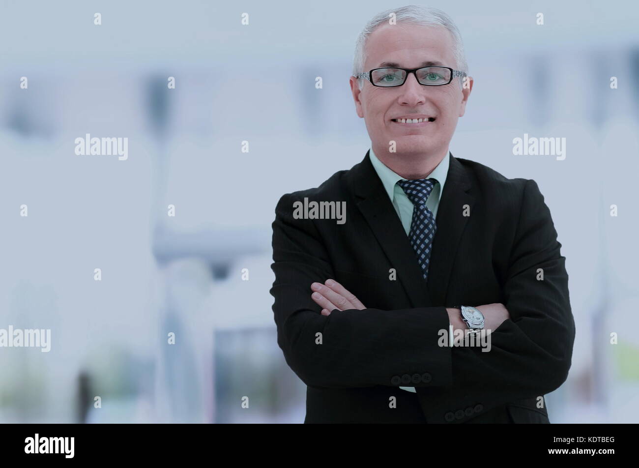 Portrait of an elegant mature business man in the office Stock Photo ...