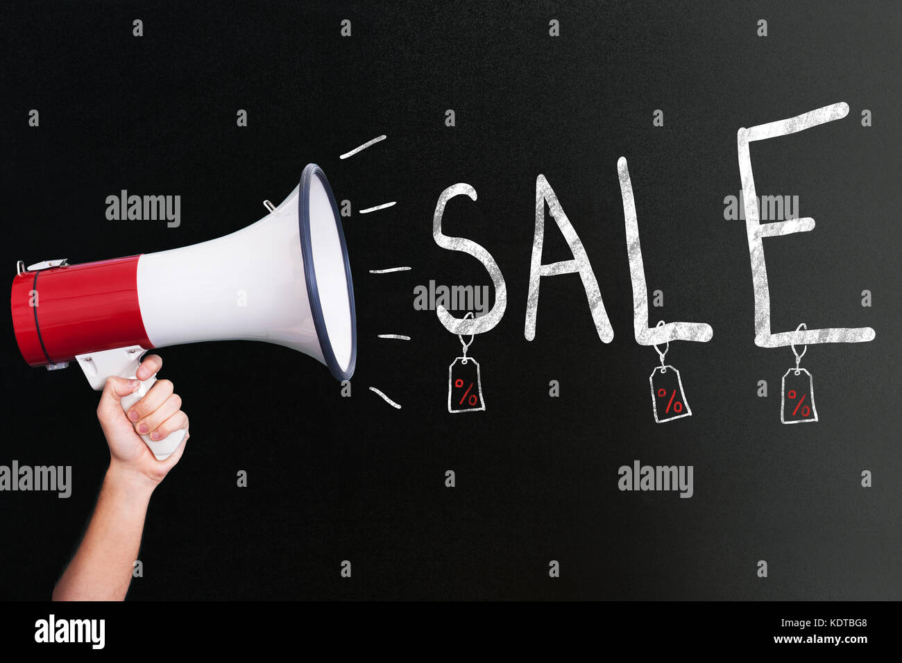 Hand Holding Megaphone Advertising Sale On Blackboard Stock Photo - Alamy