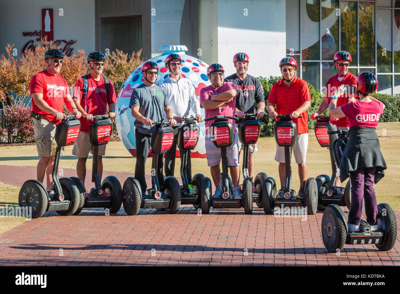 Segway tour group posing for a picture in front of World of Coca-Cola in downtown Atlanta, Georgia. (USA) Stock Photo
