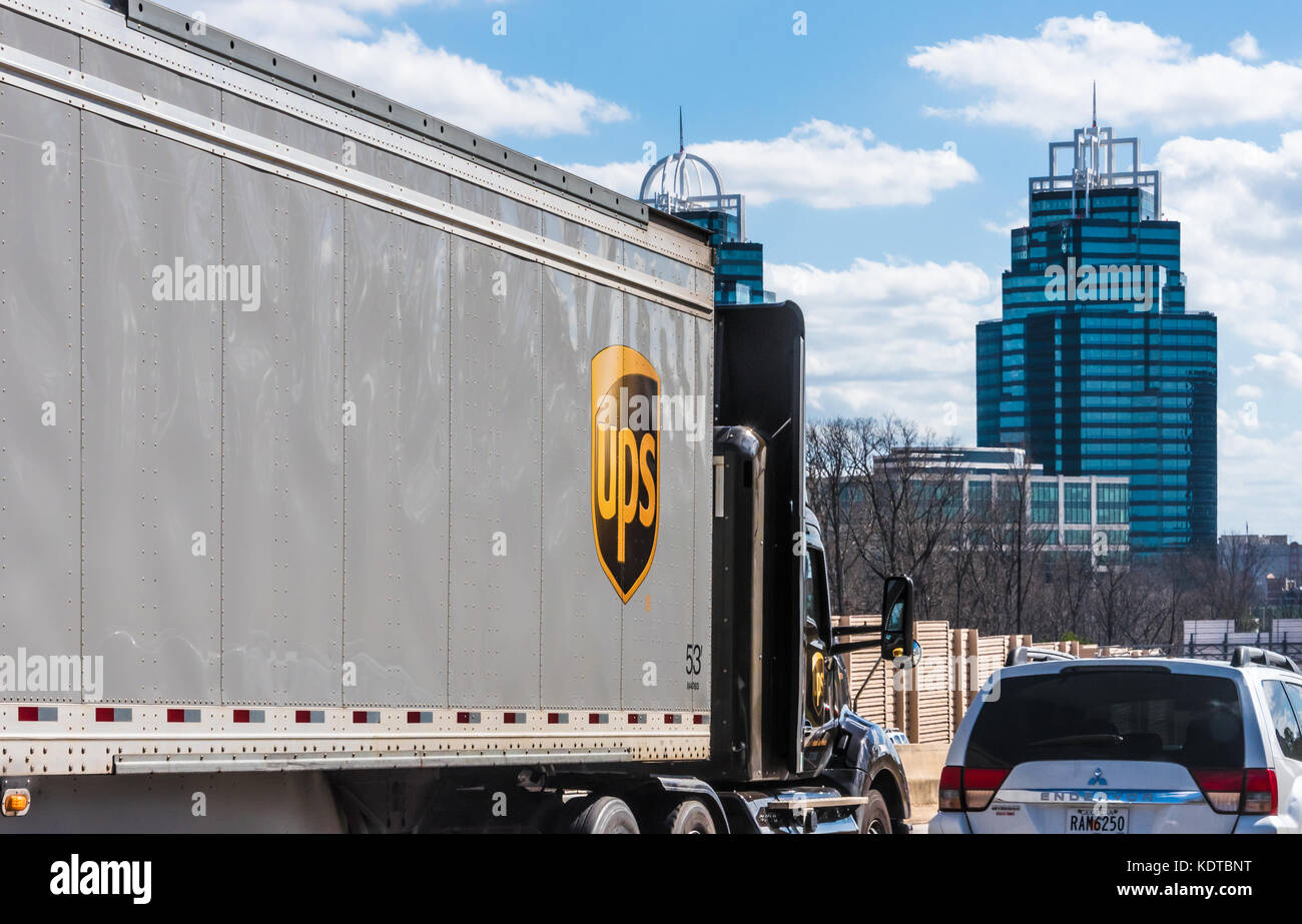 United Parcel Service (UPS) semi truck on Atlanta, Georgia's I-285 near the iconic King and Queen buildings. (USA) Stock Photo