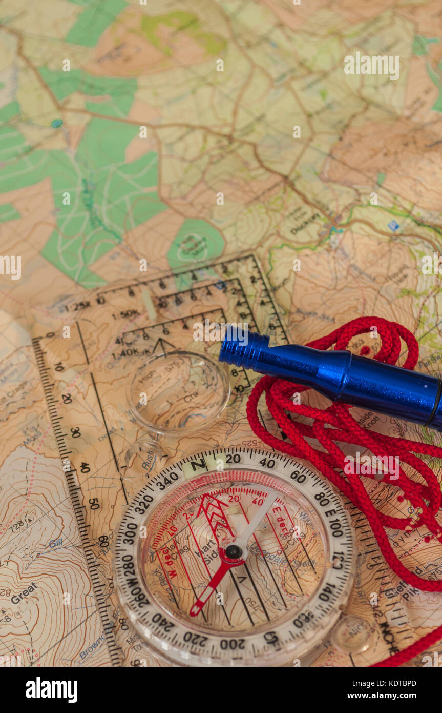 Compass showing direction on Topographic Map with Rescue Whistle