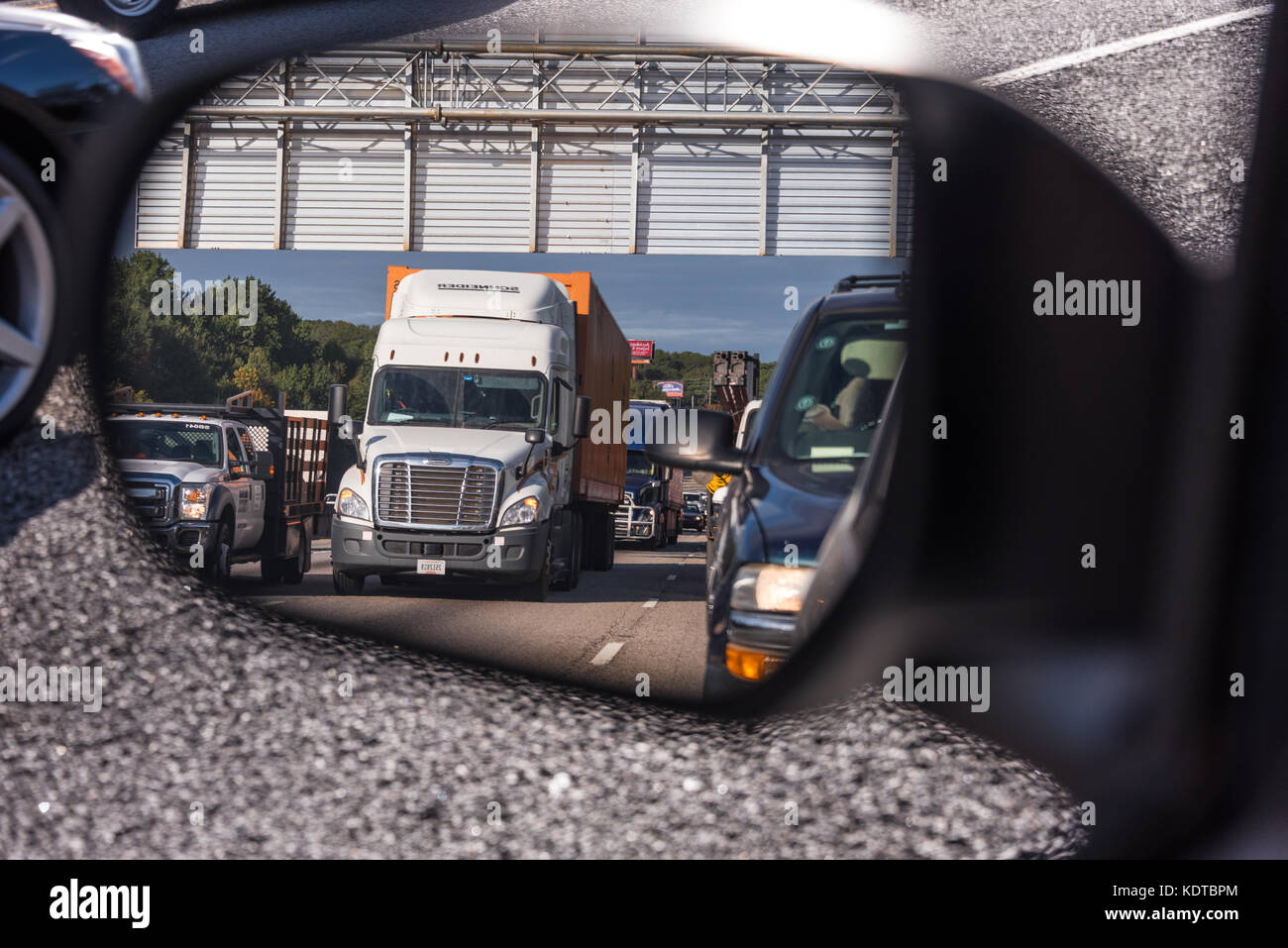 Heavy traffic in the side mirror on Atlanta, Georgia's I-285. (USA) Stock Photo