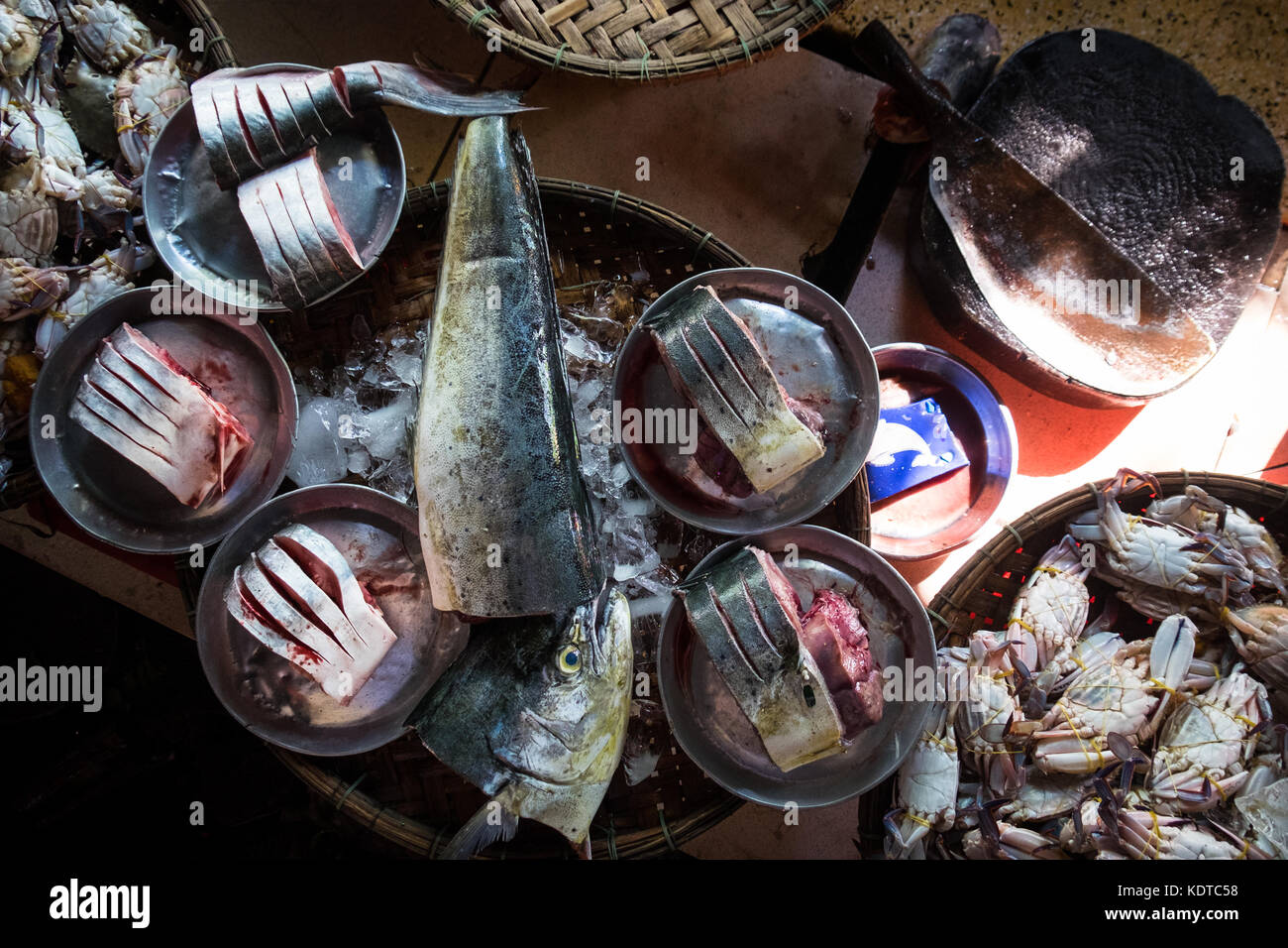 Fresh fish displayed on bamboo trays in Dong Bar Market, Hue Stock Photo
