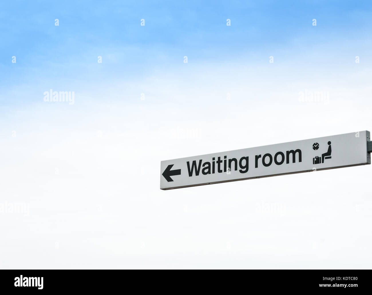 Waiting Room Sign Isolated against Sky Background Stock Photo