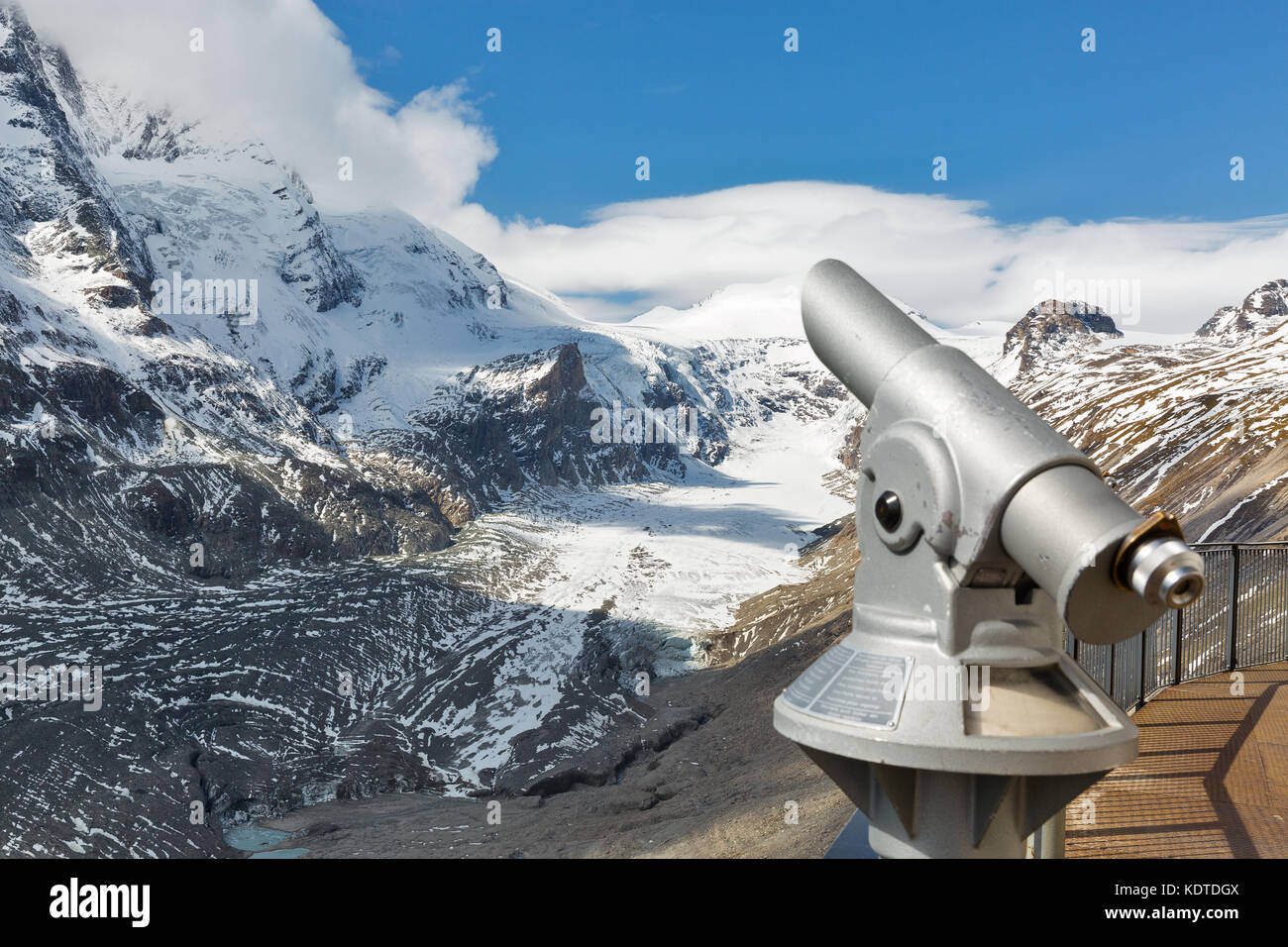 Observation point with telescope. Kaiser Franz Joseph glacier, Grossglockner High Alpine Road in Austrian Alps. Focus on background. Stock Photo