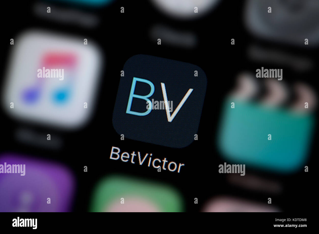 A close-up shot of the logo representing the Bet Victor app icon, as seen on the screen of a smart phone (Editorial use only) Stock Photo