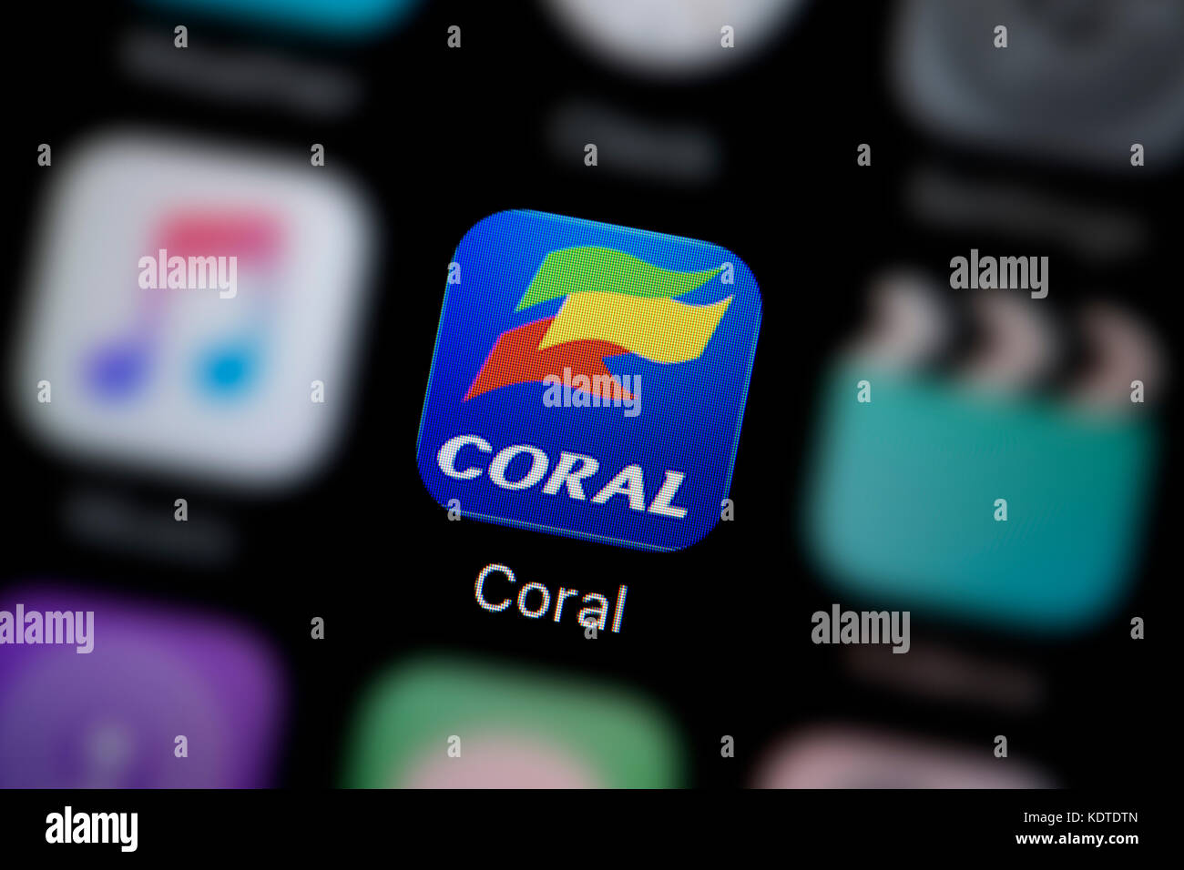 A close-up shot of the logo representing the Coral betting app icon, as seen on the screen of a smart phone (Editorial use only) Stock Photo