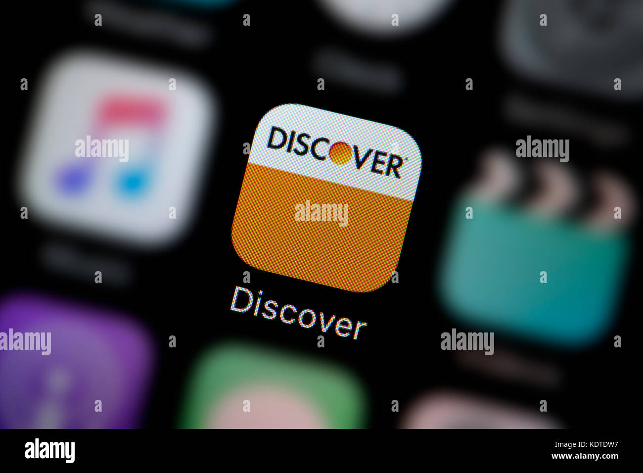 A close-up shot of the logo representing the Discover app icon, as seen on the screen of a smart phone (Editorial use only) Stock Photo