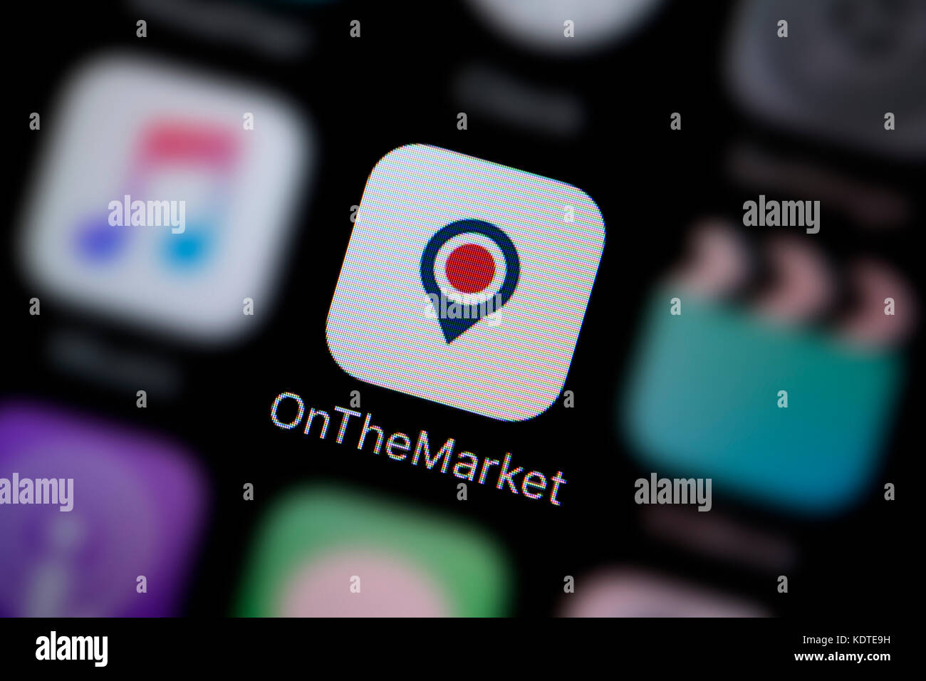 A close-up shot of the logo representing the On The Market app icon, as seen on the screen of a smart phone (Editorial use only) Stock Photo