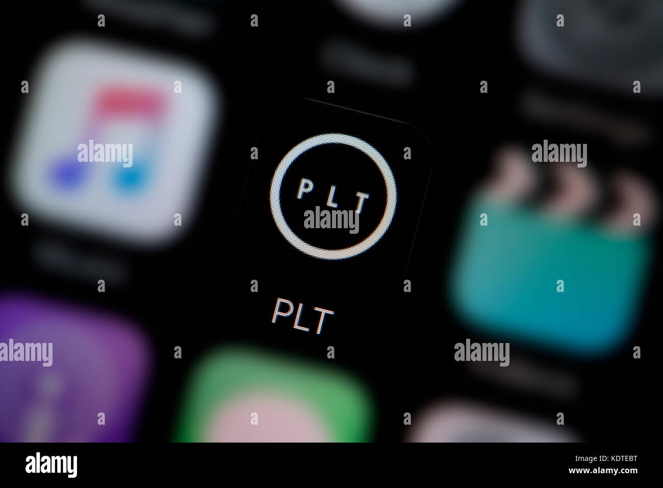 A close-up shot of the logo representing the Pretty Little Thing app icon, as seen on the screen of a smart phone (Editorial use only) Stock Photo