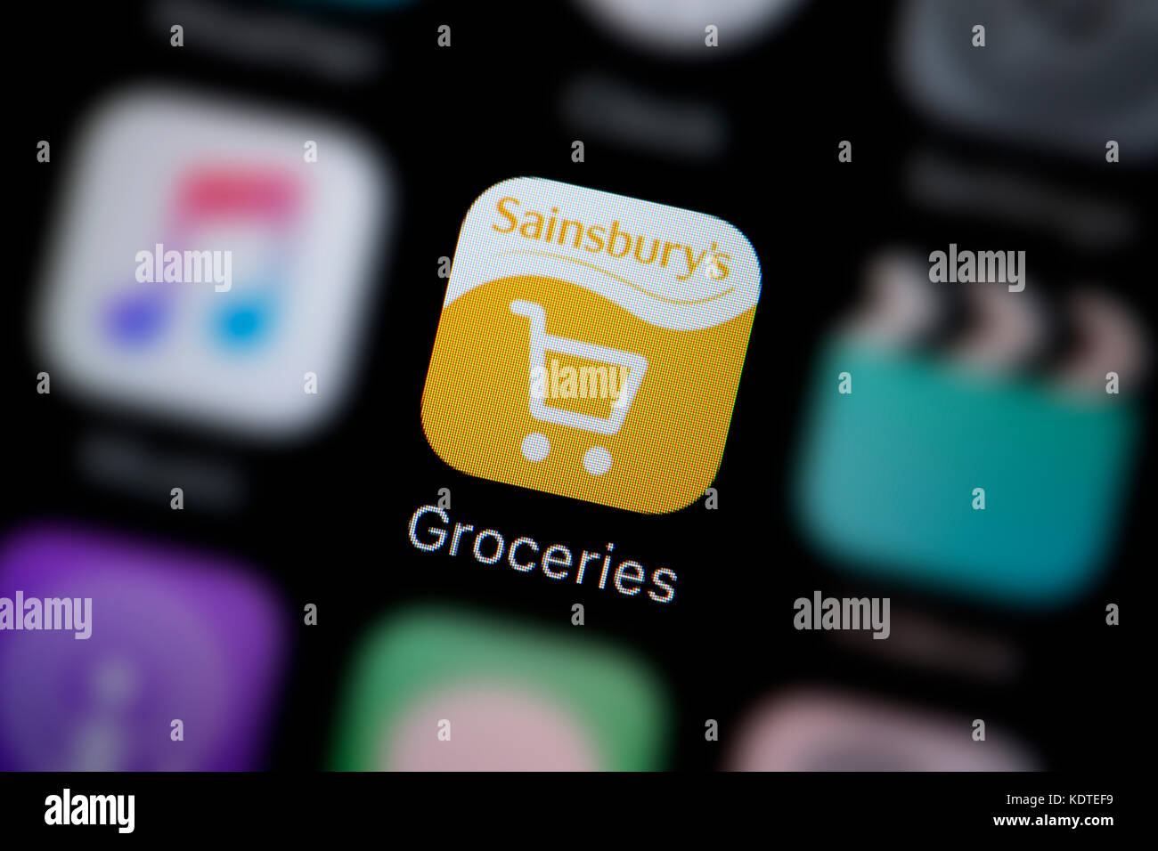 A close-up shot of the logo representing the Sainsbury's groceries app icon, as seen on the screen of a smart phone (Editorial use only) Stock Photo