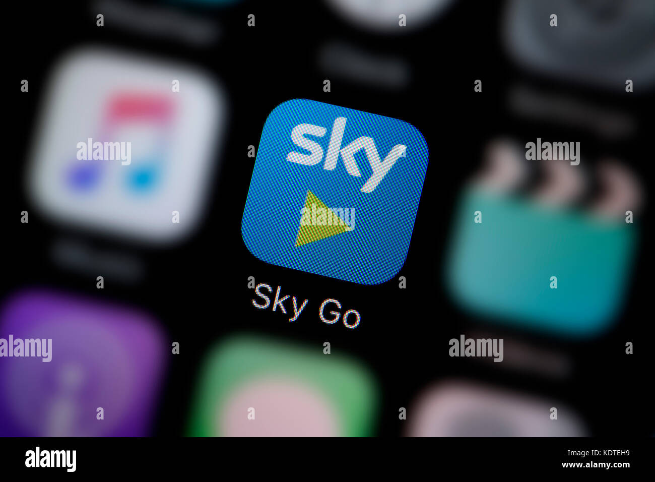 A close-up shot of the logo representing the Sky Go app icon, as seen on the screen of a smart phone (Editorial use only) Stock Photo