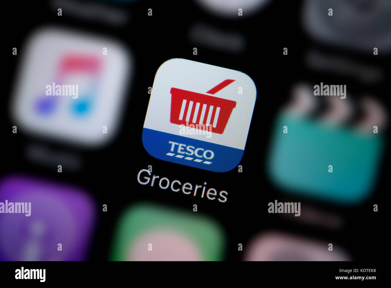 A close-up shot of the logo representing the Tesco Groceries delivery app icon, as seen on the screen of a smart phone (Editorial use only) Stock Photo