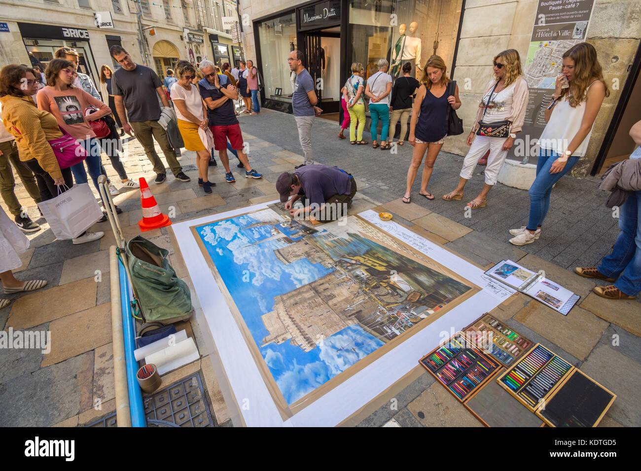 Pavement artist Didier Herry drawing with pastels, La Rochelle, France. Stock Photo