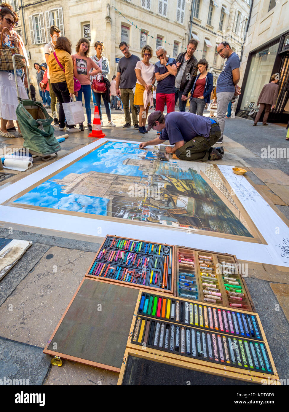 Pavement artist Didier Herry drawing with pastels, La Rochelle, France. Stock Photo
