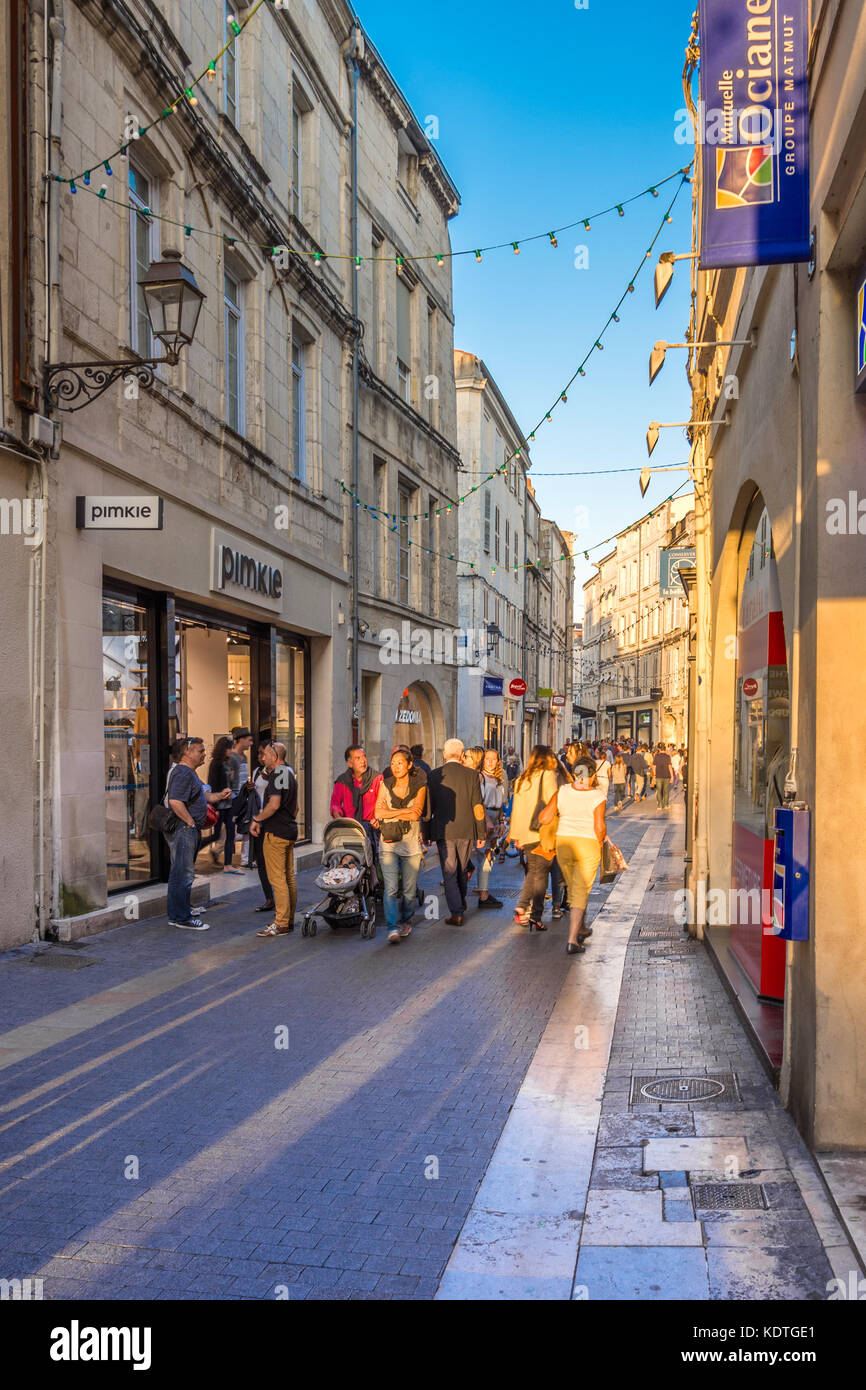 Shoppers in narrow street of the old town, La Rochelle, France. Stock Photo