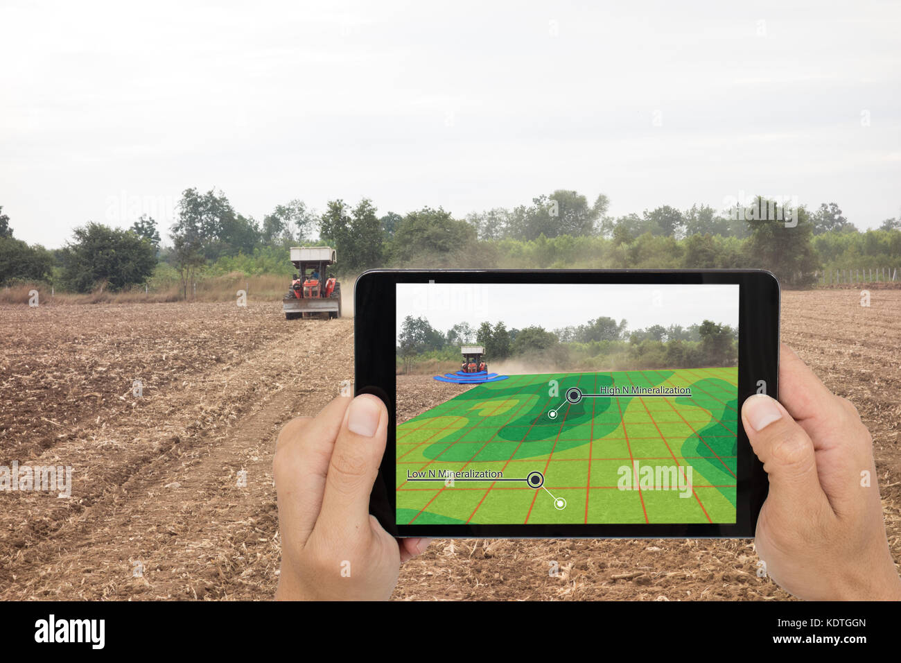 smart agriculture concept, farmer use tablet read infrared in tractor