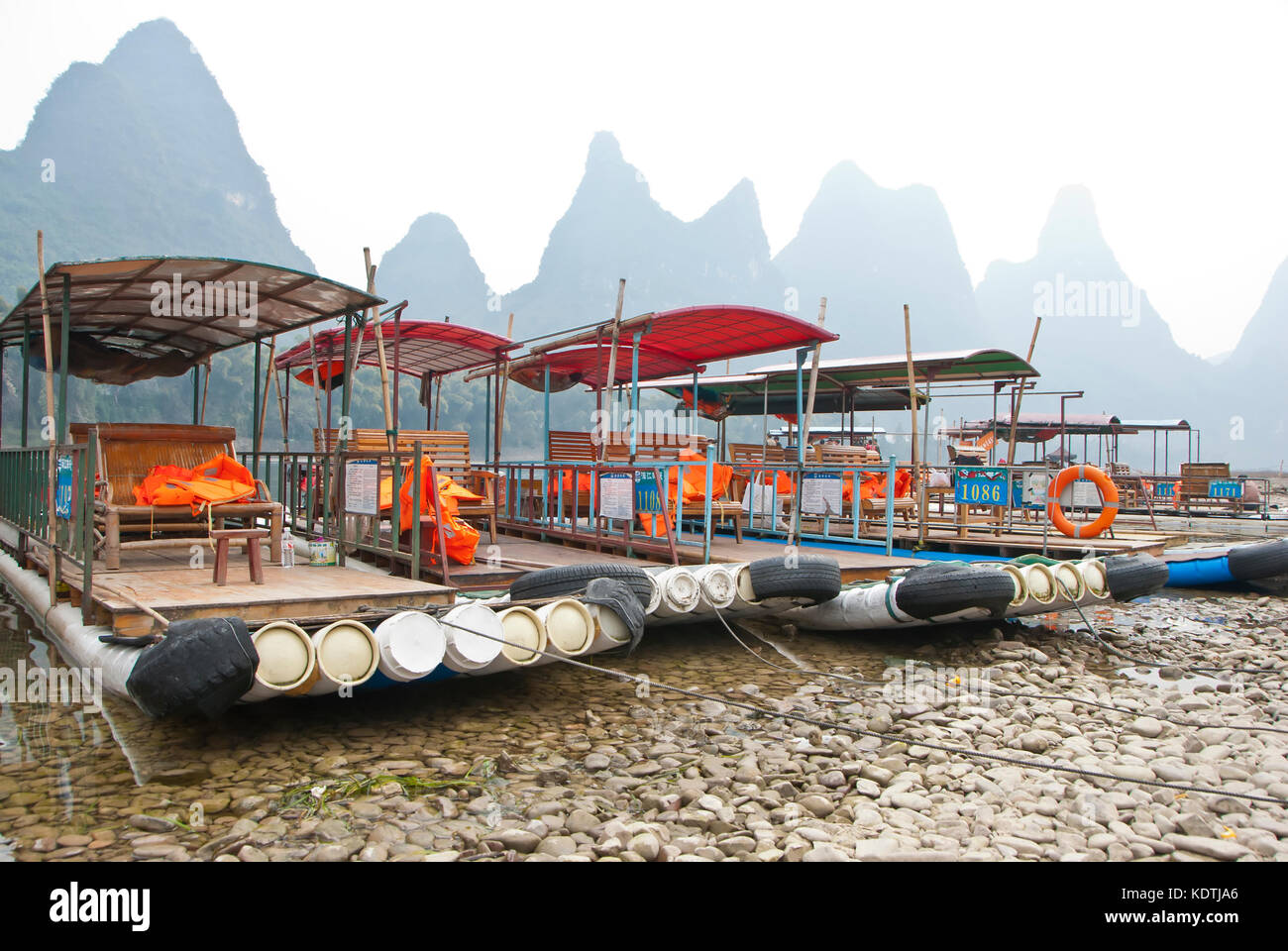 Bamboo Raft in Winter, Li River, Guilin, China  - The Li River or Lijiang is a river in Guangxi Zhuang Autonomous Region, China. Stock Photo