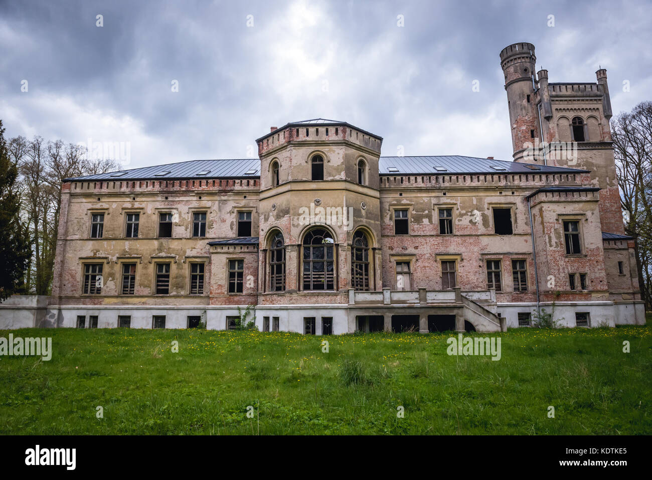 Facade of abandoned Gothic Revival palace in Drezewo village in West Pomeranian Voivodeship of Poland Stock Photo