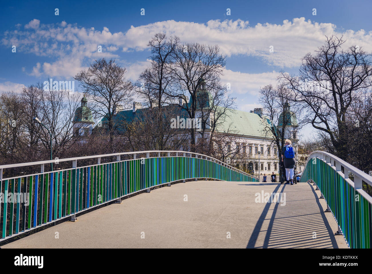 Pedestrian bridge over Lazienkowska Thoroughfare in Warsaw, Poland. Ujazdow Castle on background Stock Photo