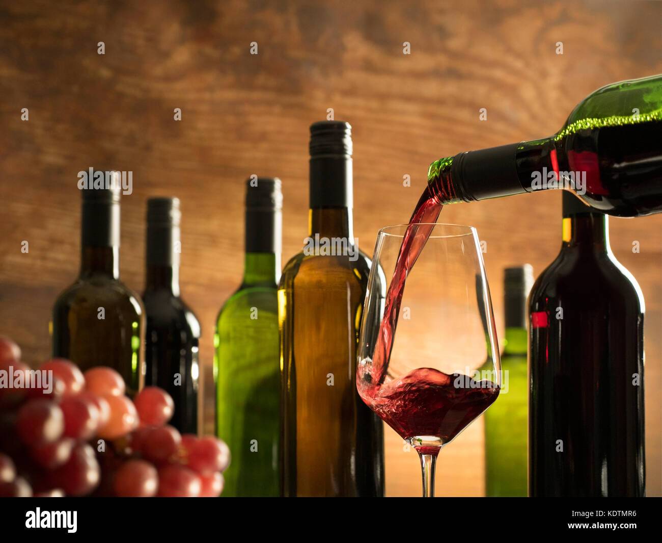 Rural wine tasting atmosphere in a winery cellar just pouring red wine