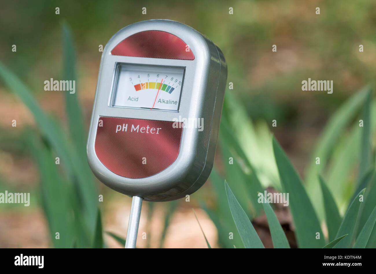 analog tool to measure soil ph - assembly close up with plants background Stock Photo