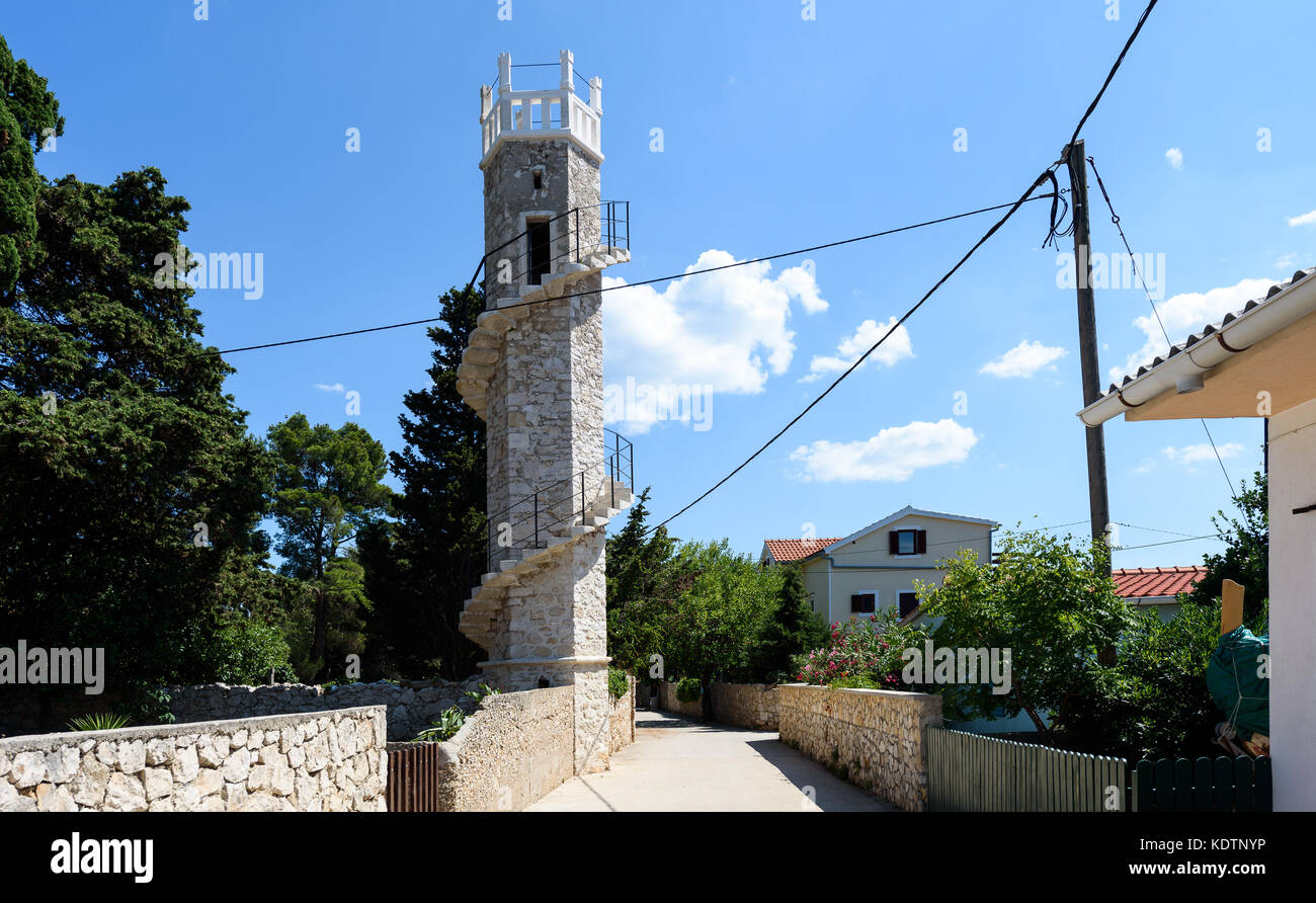 Toreta - the tower of love on island Silba Croatia. Old stone made tower in the Mediterranean island Silba in Adriatic sea - Croatia. Stock Photo