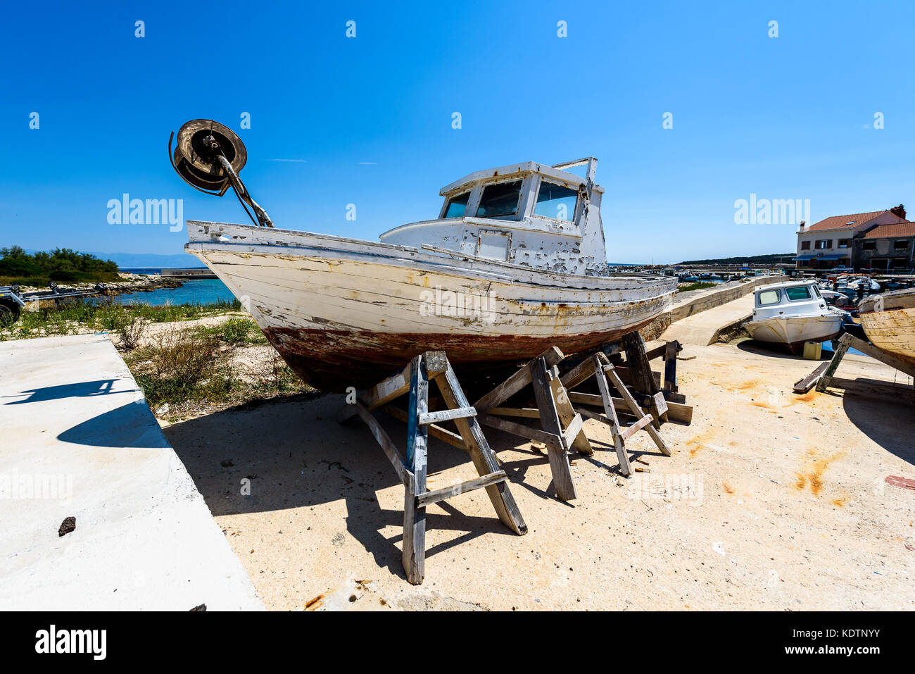 Repair and restoration of old wooden fishing ship or boat. Old