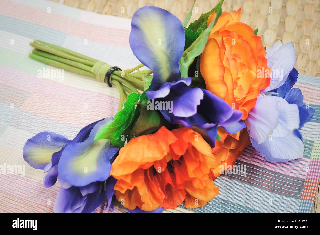 Bunch of Artificial Orange Ranunculus Flowers with Blue Flowers for
