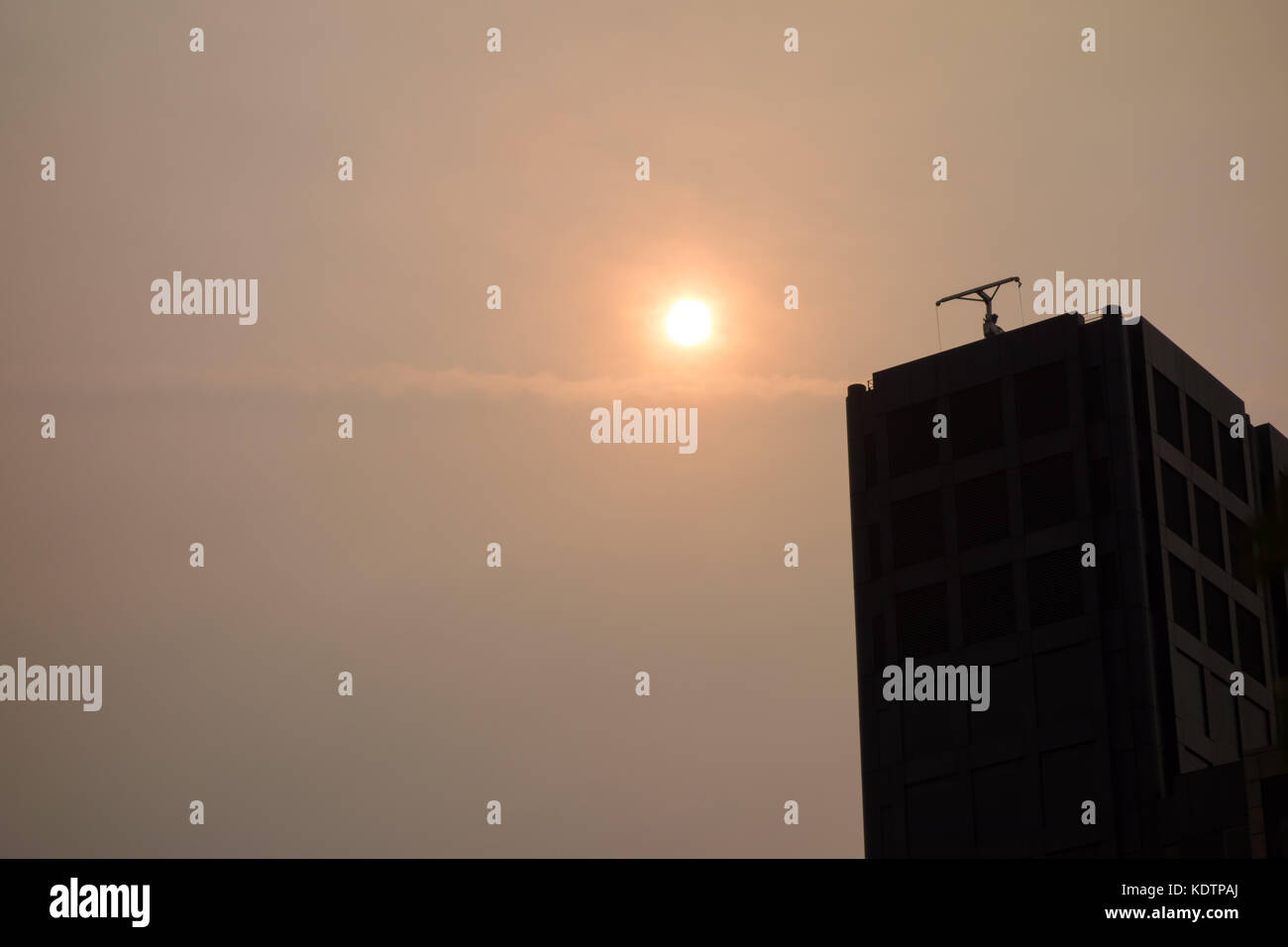 LONDON, UK - 16th Oct 17: The strange red sun that is caused by Hurricane Ophelia and dust up from southern Europe and Africa overlooks 200 Aldersgate Stock Photo