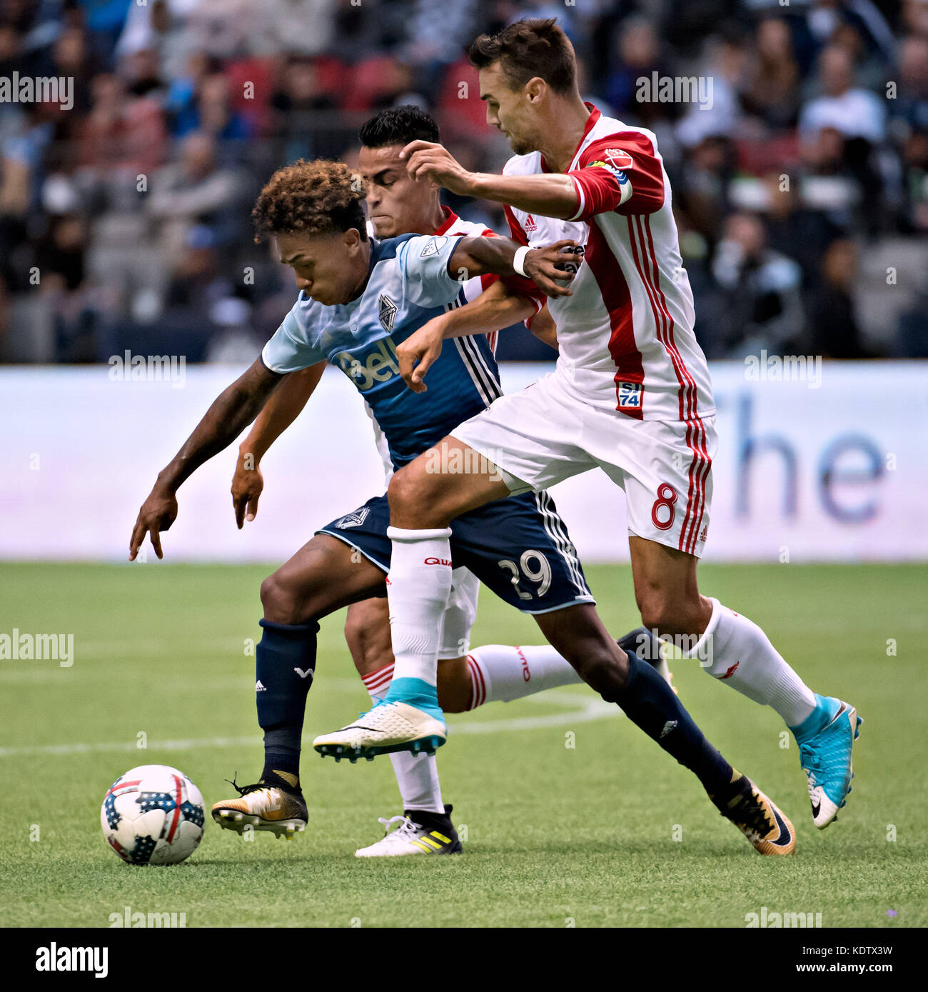 (171016) -- VANCOUVER, Oct. 16, 2017 (Xinhua) -- Yordy Reyna (L) of Vancouver Whitecaps vies with Chris Wondolowski of San Jose Earthquakes during the MLS regular season match between Vancouver Whitecaps and San Jose Earthquakes at BC Place Stadium in Vancouver, Canada, on Oct. 15, 2017. The match ended with a 1-1 draw.(Xinhua/Andrew Soong) Stock Photo