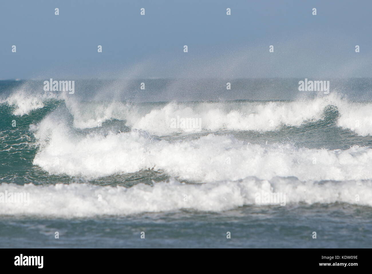 Newquay, UK. 16th Oct, 2017. UK Weather. Strong offshore winds from ex-Hurricane Ophelia blow back the high surf on the north coast of Cornwall on Fistral Beach. Credit: Nicholas Burningham/Alamy Live News Stock Photo